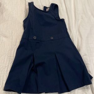 Girls sleeveless uniform jumper. Used. Size 4. Navy Blue.